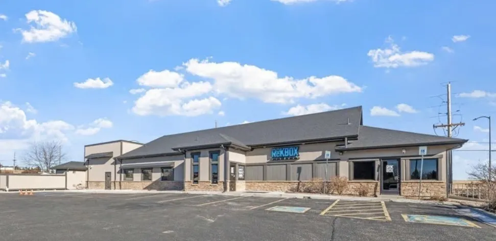 Commercial building constructed by Monument Home Builders beneath a blue sky